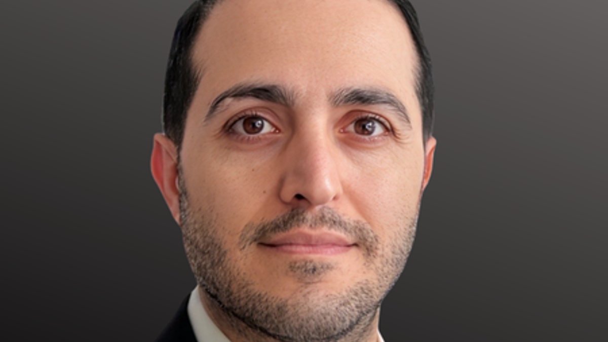 Trade Leader Earns CITP, Champions Ethical Global Commerce Morteza Mehdizahdeh Headshot on dark grey background.