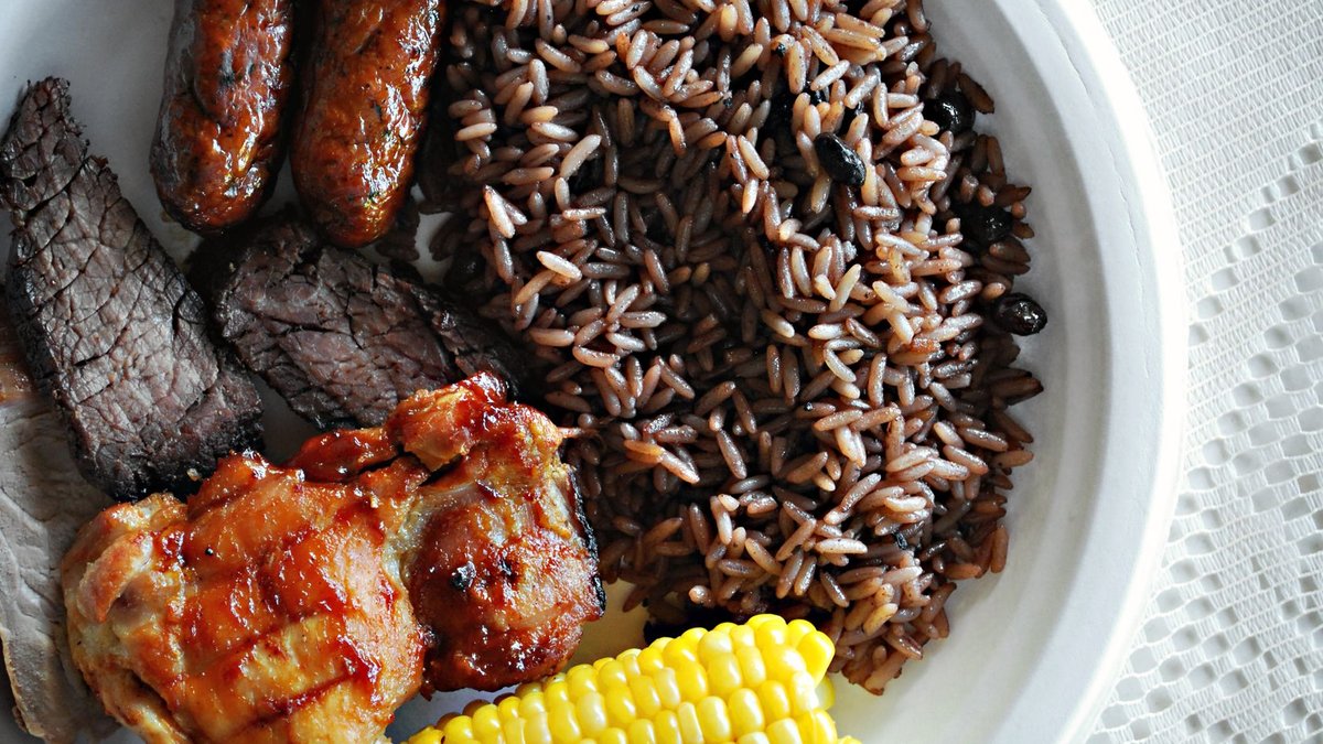 Lidl launches high protein meat range A hearty meal featuring rice, grilled meats, and corn on a plate.