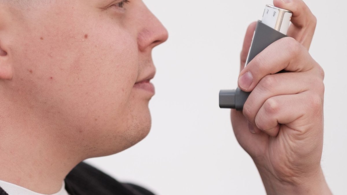 Tirzepatide and semaglutide have similar asthma risks Close-up of an adult using an inhaler for asthma management.