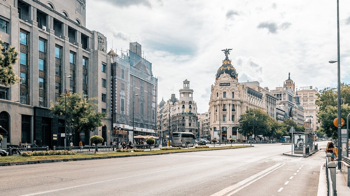 Invesco Hires BlackRock's Tim Clavin for ETF Capital Markets Madrid, city, road, nature, sky, clouds, building, urban, capital, street, cars.