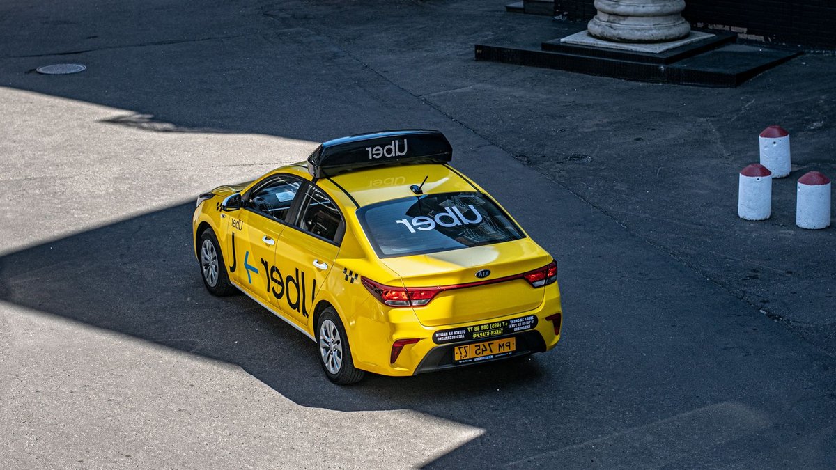 Uber launches live video feature for teen rides in Mexico A yellow Uber taxi driving on a city street, shown from above.