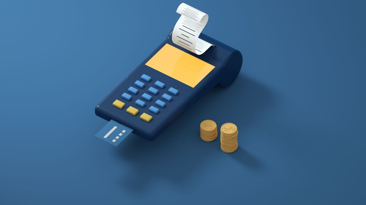 UK Open Banking hits 100 B API calls Blue payment terminal with receipt and gold coins on a blue background, symbolizing modern transactions.