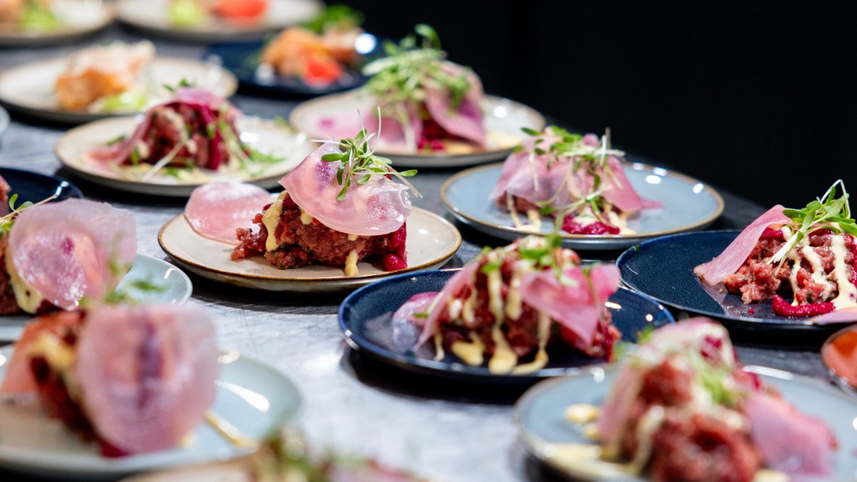 A variety of gourmet tapas presented beautifully in an upscale restaurant, highlighting culinary artistry.