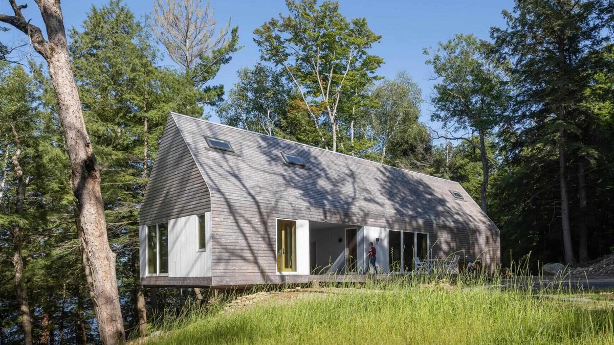 Ontario cottage reimagines historic dogtrot design A modern prefab cottage in Magnetawan, Canada, designed with a simple gabled form, cedar siding, and an elevated structure th