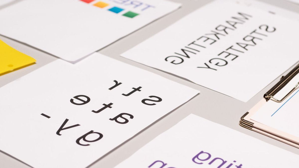 A top view of marketing strategy documents and graphs arranged on a desk, showcasing business planning.
