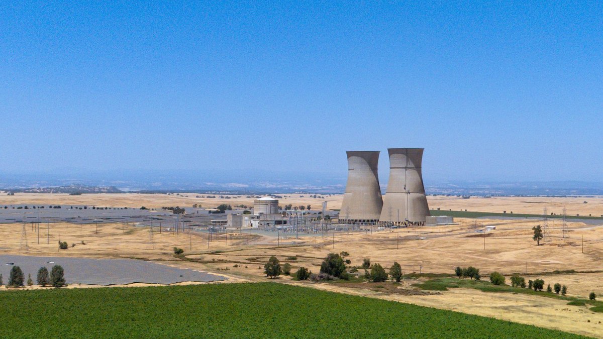Canada aids India’s shift to thorium-based nuclear fuel A low-angle photo of the cooling tower of a nuclear power station. There are tree fronds and an Indian flag in the foreground