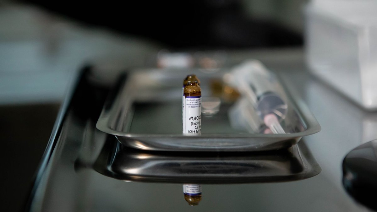 FDA approves first new drug for rare blood cancer Focus on a vial placed on a stainless steel tray, reflecting a clinical and sterile medical environment.