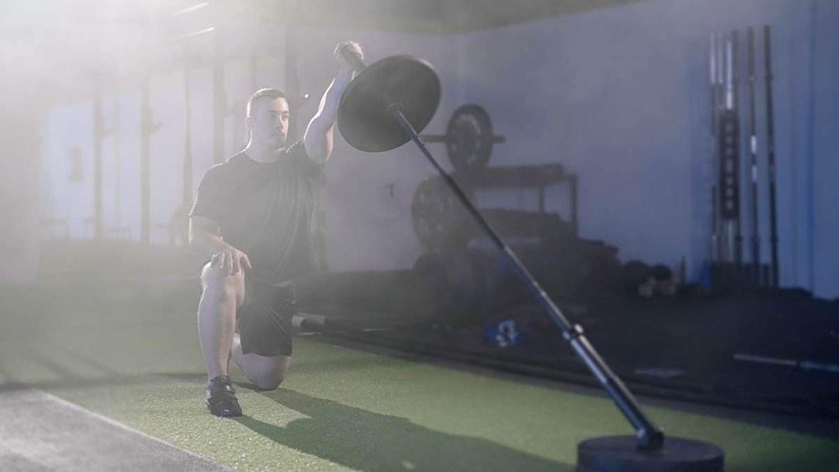 Experts Detail Proper Setup for Half-Kneeling Landmine Press - landmine press
