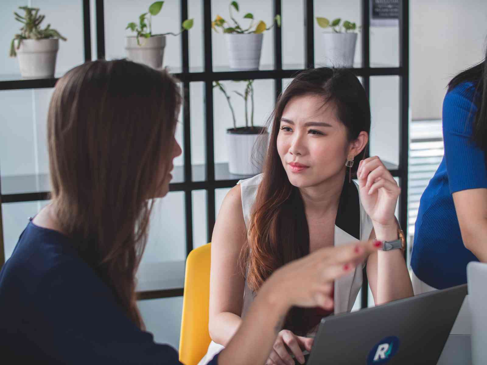 Women discussing something during meeting