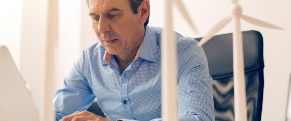 A Wind Energy Engineer engrossed in designing wind farms.