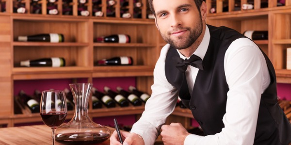 A sommelier or wine steward is an expert in fine wine and is responsible for serving it to patrons.