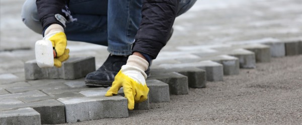 A segmental paver is a construction and home renovation specialist who installs flat segments of brick, concrete, or other stone-like building materials.