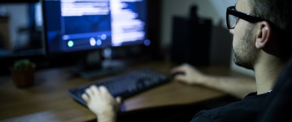 A security software developer working on his computer.