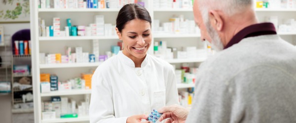 A pharmacist traditionally works in a pharmacy and is in charge of the dispensing of prescription medications.