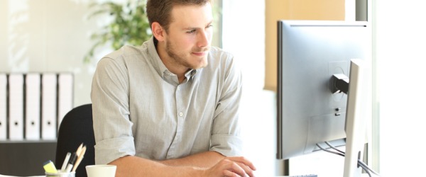 A network administrator working on his computer.