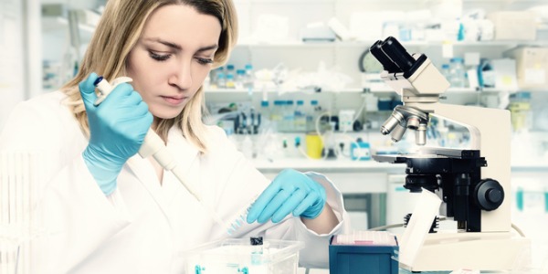 A molecular biologist working in a laboratory .