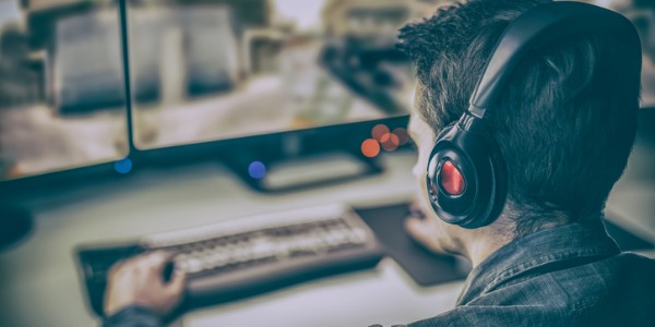 A games tester testing a video game before the final version is released to the public.