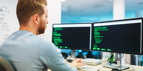 A full stack developer working on his computer.