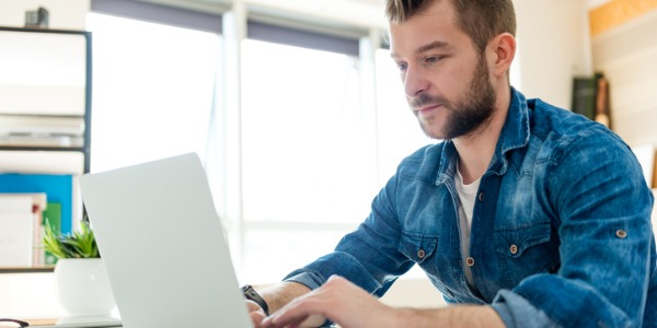 A front-end developer working on his computer.