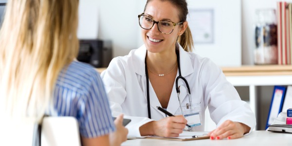 A family practitioner talking to her patient.