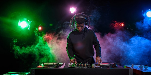 A DJ playing music at a club.