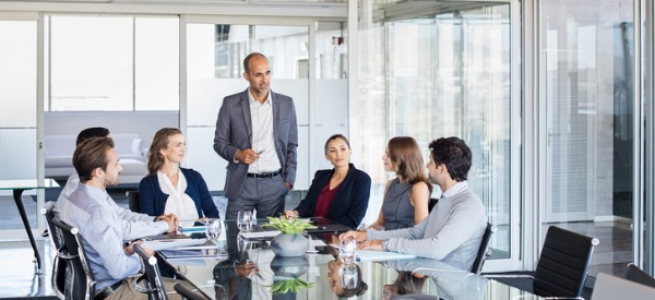 A CISO talking to employees on how to maintain a company's information security program.