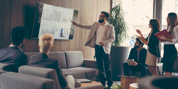A CIO, or Chief Information Officer speaking to employees about information technology within their organization.