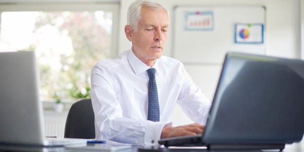 A chief executive devising strategies and policies to ensure that the organization meets its goals.