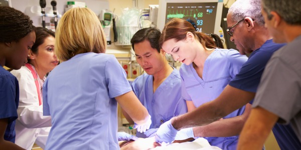 Acute care nurses and doctors working on an emergency situation.