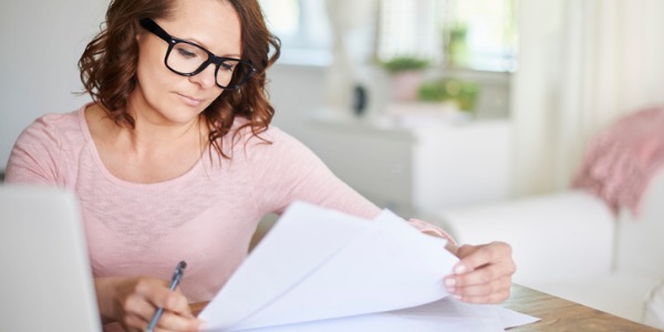 An artist and repertoire administrator looking at financial transactions.