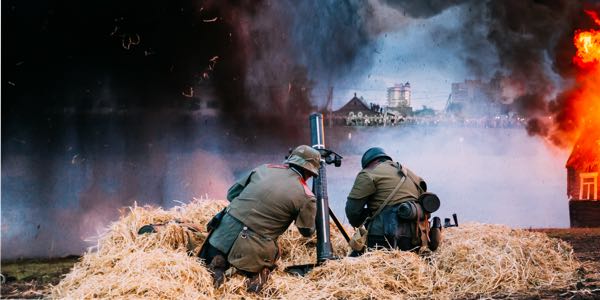 Artillery crew members firing a missile.
