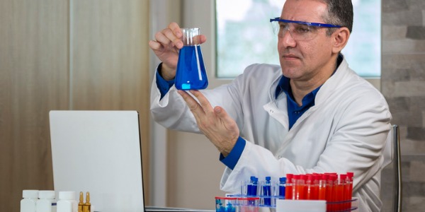 A biochemical engineer conducting experiments.
