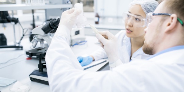 Two biochemists studying DNA.