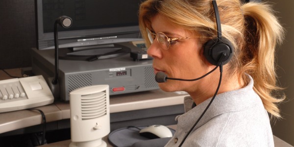 An ambulance dispatcher at work in an emergency communication centre.