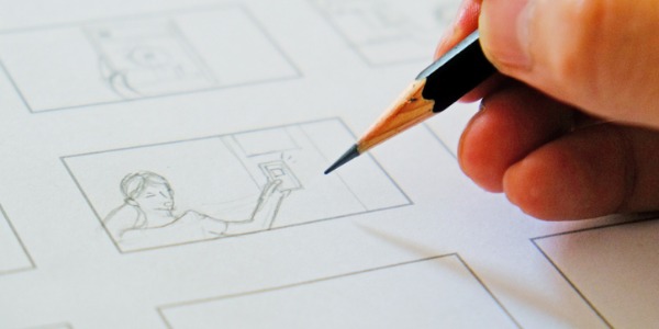 A storyboard illustrator creating a storyboard with pencil drawings.