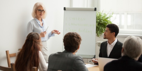 Chief executive showing a company's future outlook to the team.