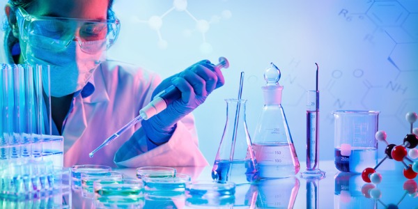 A chemist studying living organisms.