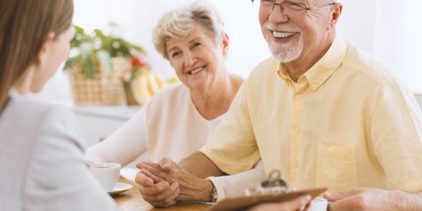 Financial advisor going over retirement plan with a senior couple.