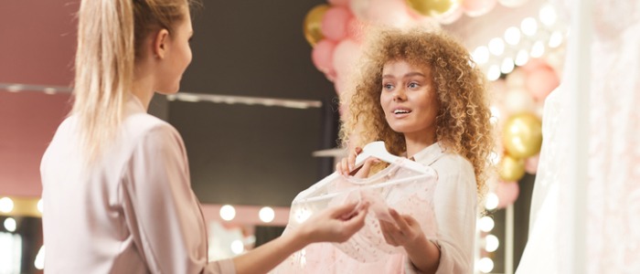 A costume attendant organizing costumes for a show.