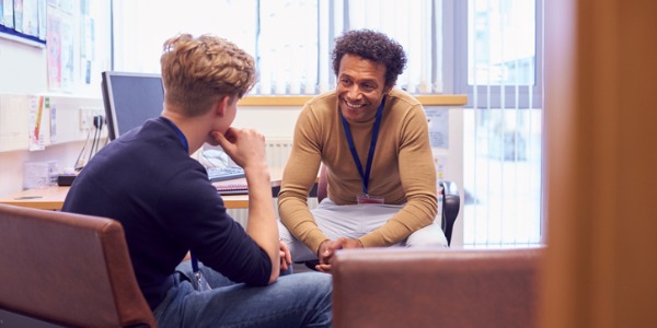 A psychotherapist talking to his client.