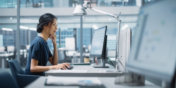 An informaticist working at her desk.