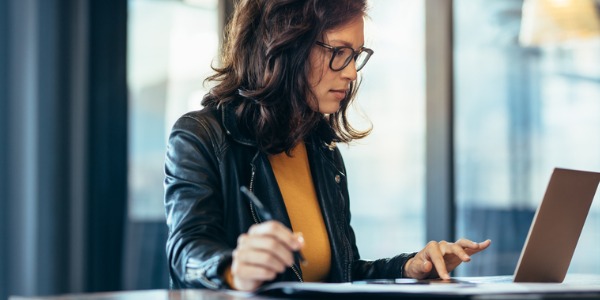 A television writer sitting in front of her computer