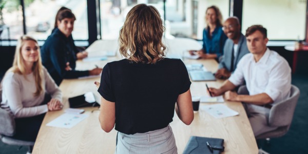 A marketing manager having a meeting with her marketing team.