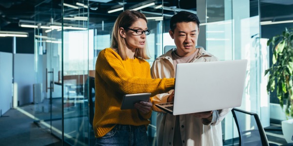 A technical product manager having a meeting with her colleague.