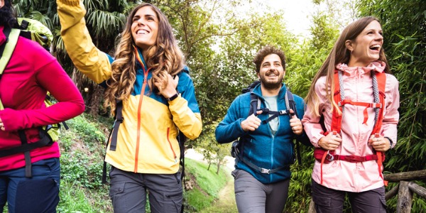 Hikers going on an ecotour with a guide.