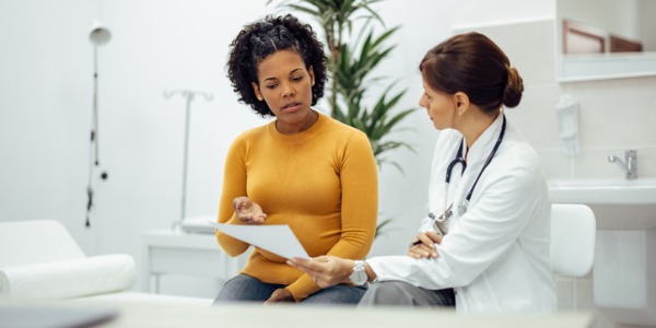 A doctor talking with her patient.