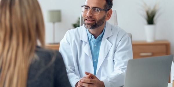 An internist speaking with one of his patients.