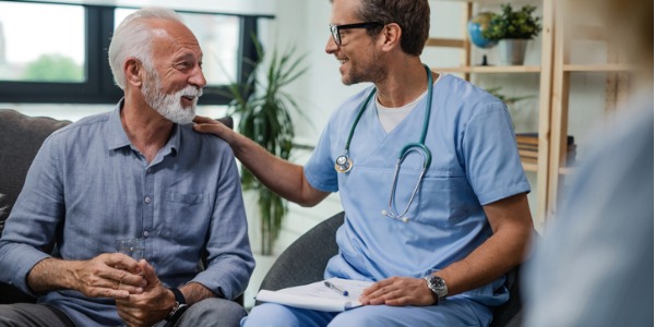 A urologist talking to a male patient.