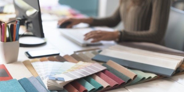An interior designer working at her desk.