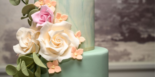 A cake with decorative sugar flowers.
